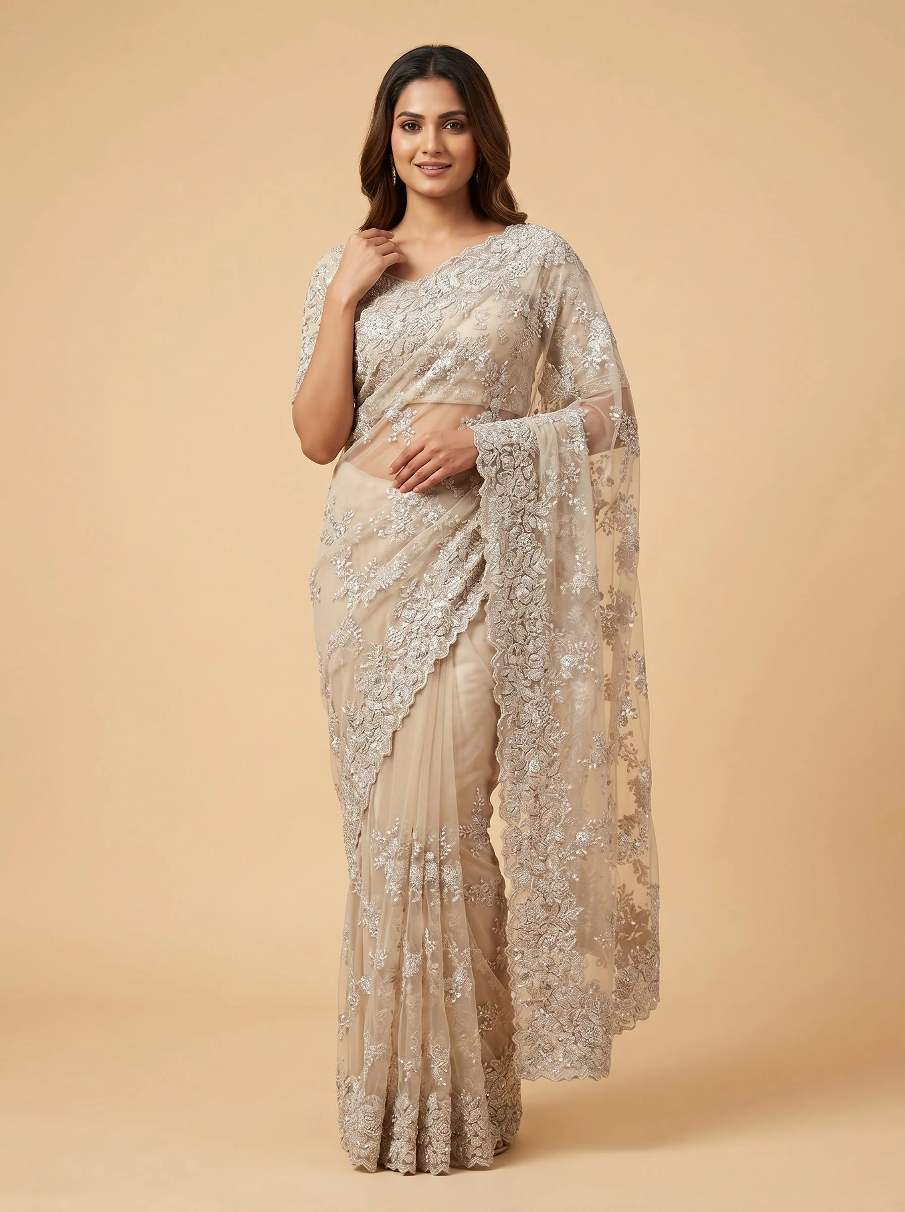 Beige embroidered saree with subtle motifs