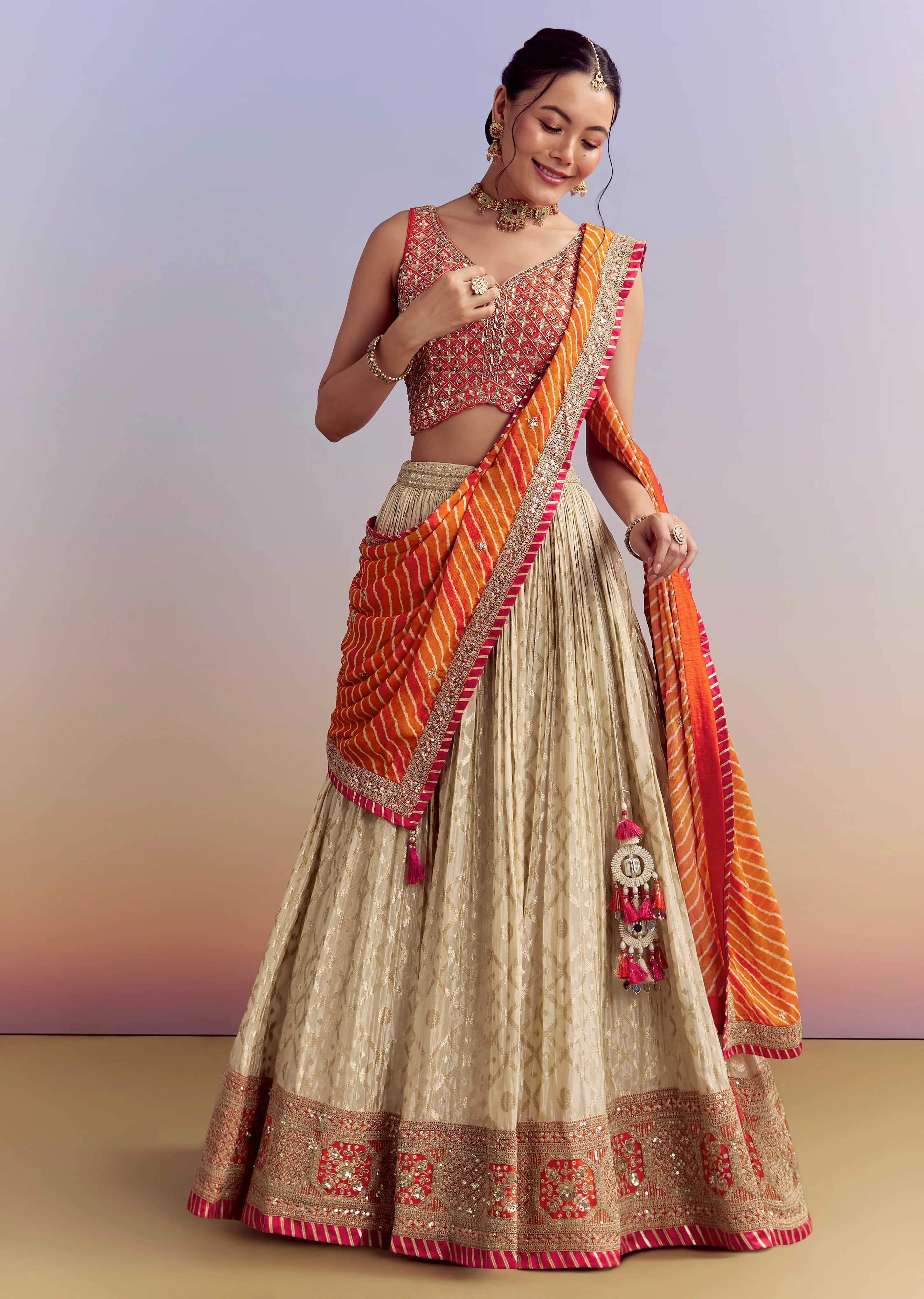 Festive Wedding Couple Set – Orange Brocade Bridesmaid Lehenga with Leheriya Dupatta for Her And Pink Embellished Tissue Kurta Set for Him - Image 3