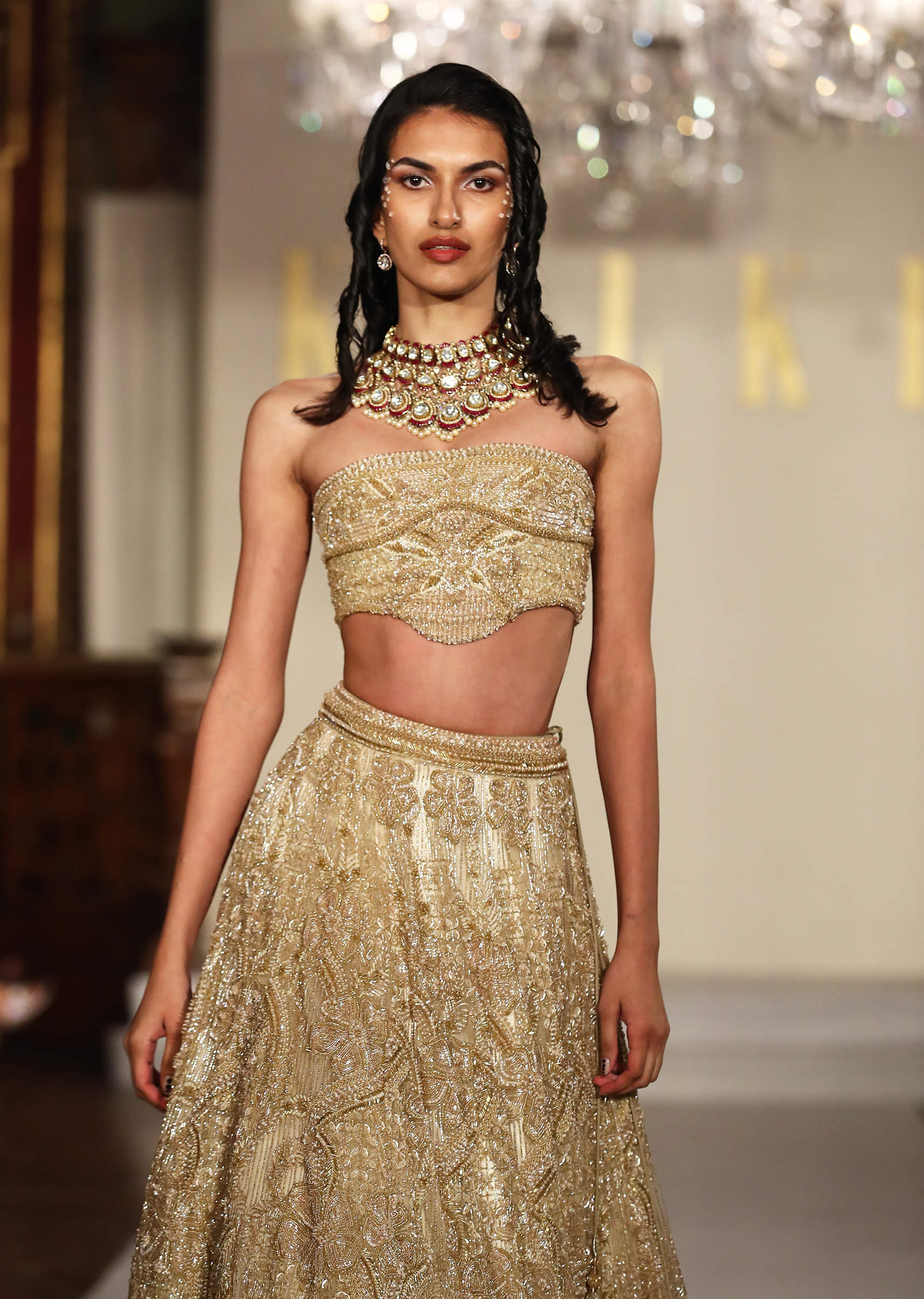 Gold Net Bridal Lehenga With Embroidered Corset Blouse - Image 2