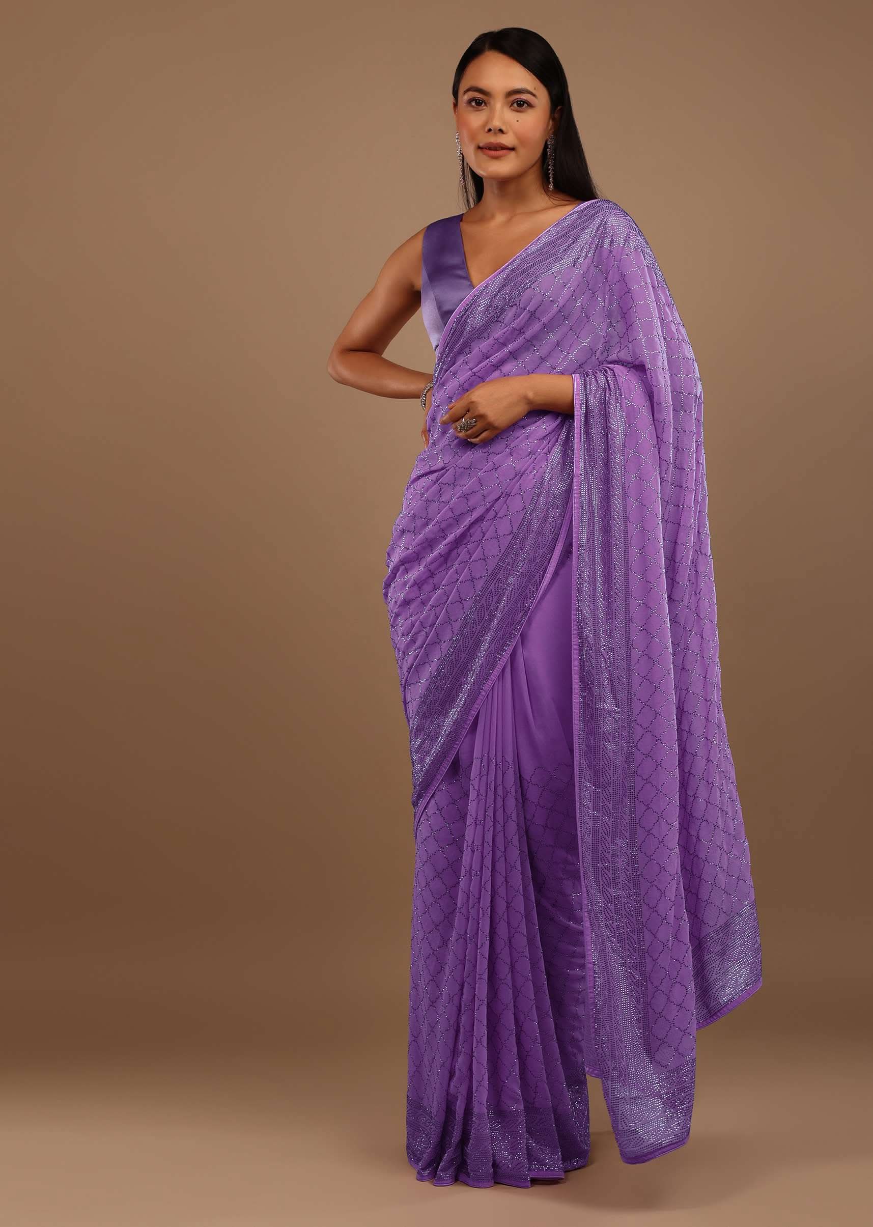 Light Purple Georgette Saree With Swarovski Stonework On The Borders And A Stonework Added Unstitched Blouse