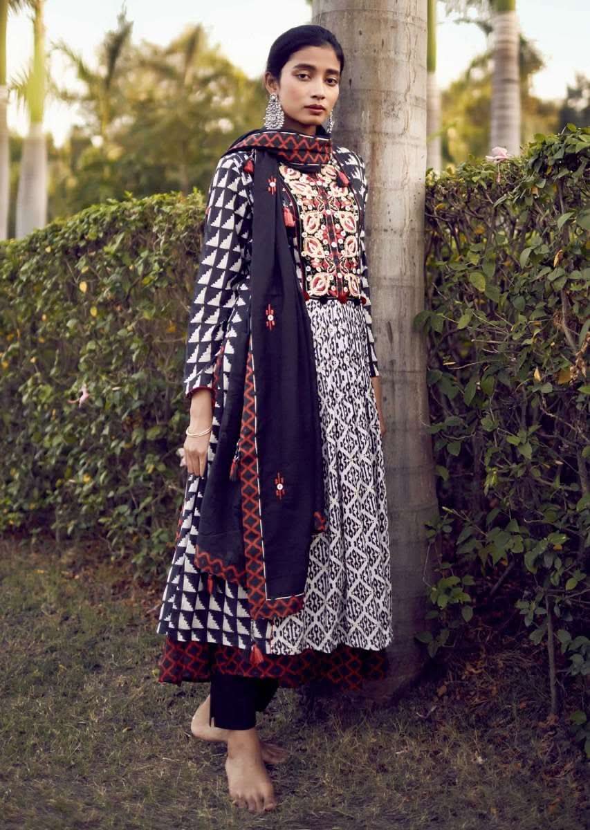 Off White A Line Suit In Cotton With Black Tribal Print With Colorful Resham Flowers On The Yoke Online - Kalki Fashion