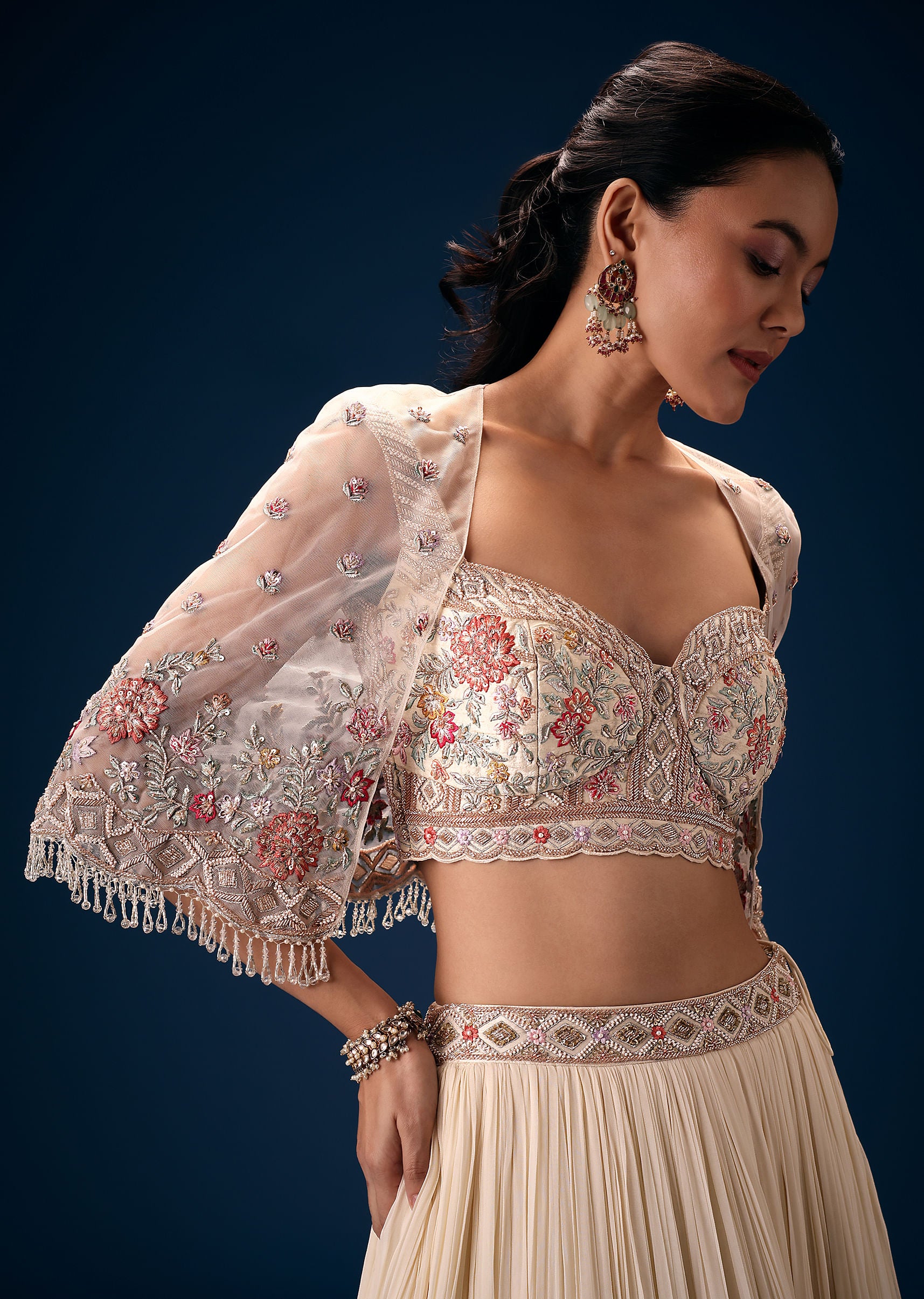 Off White Tiered Lehenga With Embroidered Corset Blouse And Embroidered Cape - Image 4