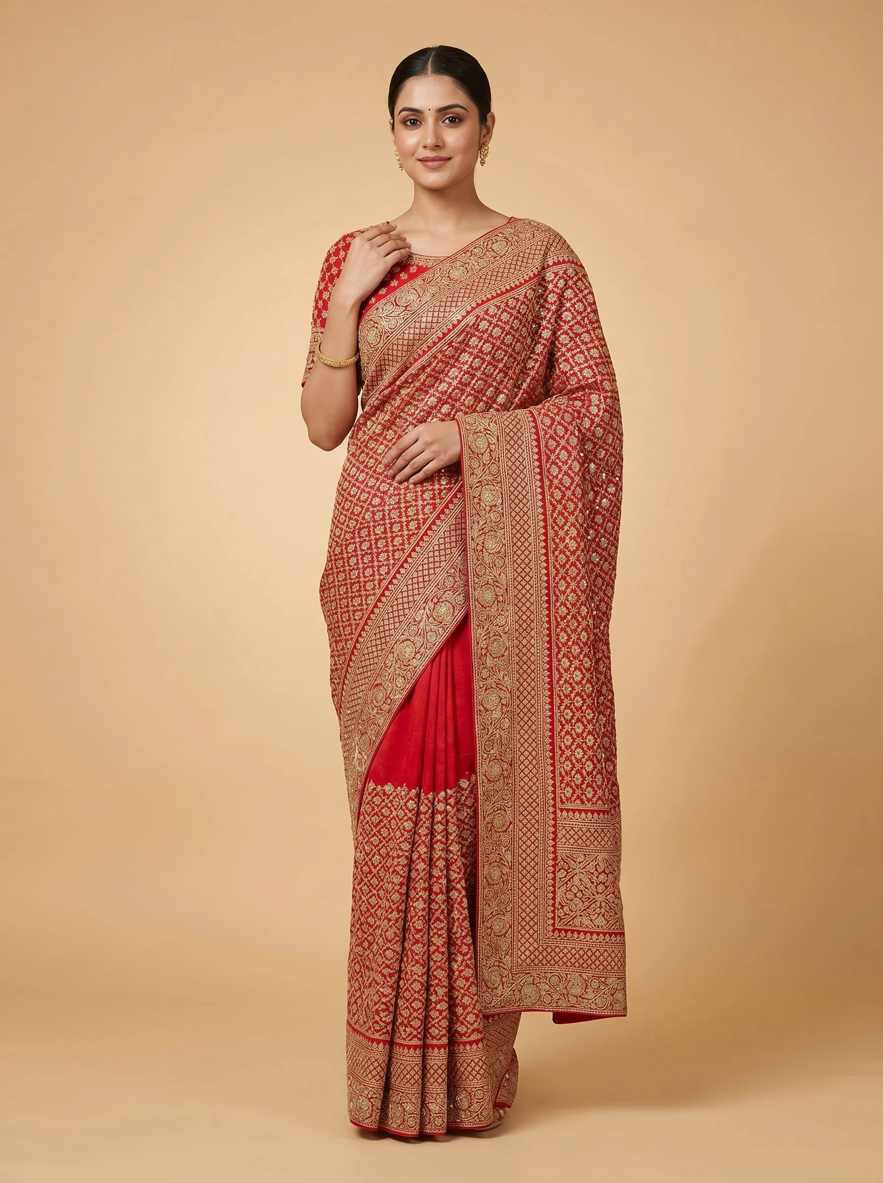 Red embroidered saree with detailed finish