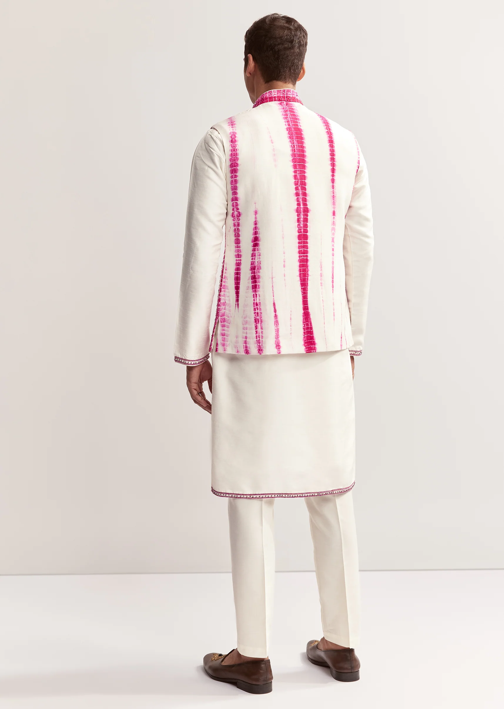 Vibrant Bandhani Festive Couple Set – Bandhani Cape Skirt Set For Her And Pink Silk Tie-Dye Kurta Jacket Set For Him - Image 10